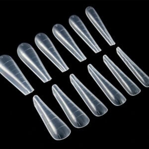 Transparent acrylic nail tips arranged in a neat row for professional manicures and nail enhancements in Northern Ireland.