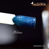 Blue gel nail polish being cured under a UV light, showcasing professional nail care services at Truscada Northern Ireland.