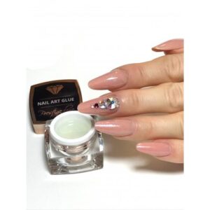 High-quality nail art gel with sparkling embellishments applied on a well-manicured hand, showcasing professional nail enhancements available at Truscada Northern Ireland.